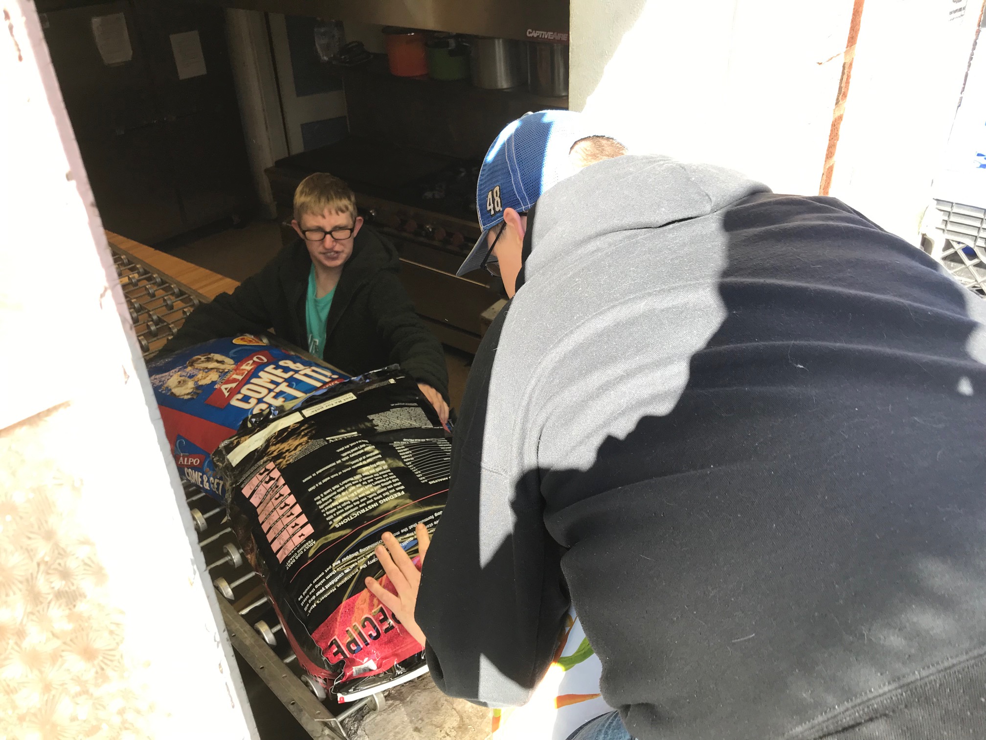 Volunteers loading food boxes